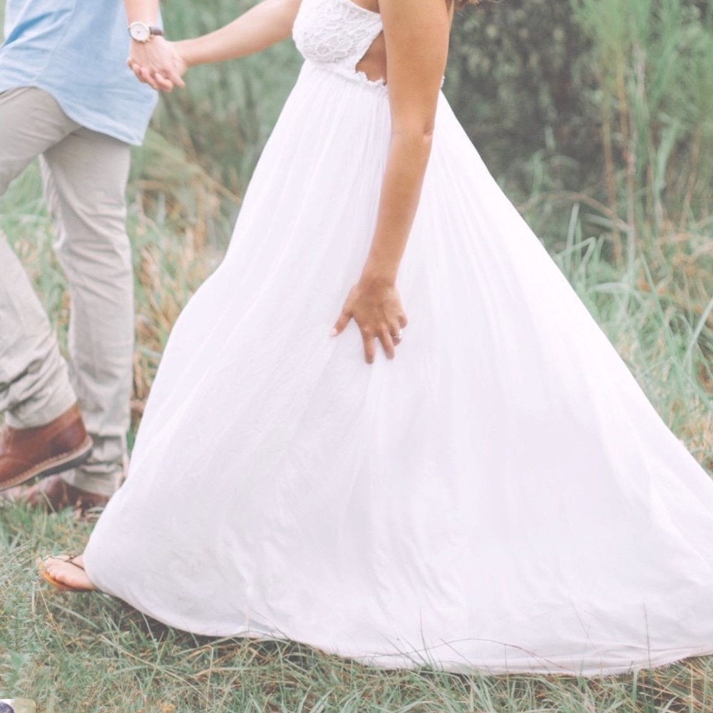 Long white whimsical dress. Open back. Flowy style .